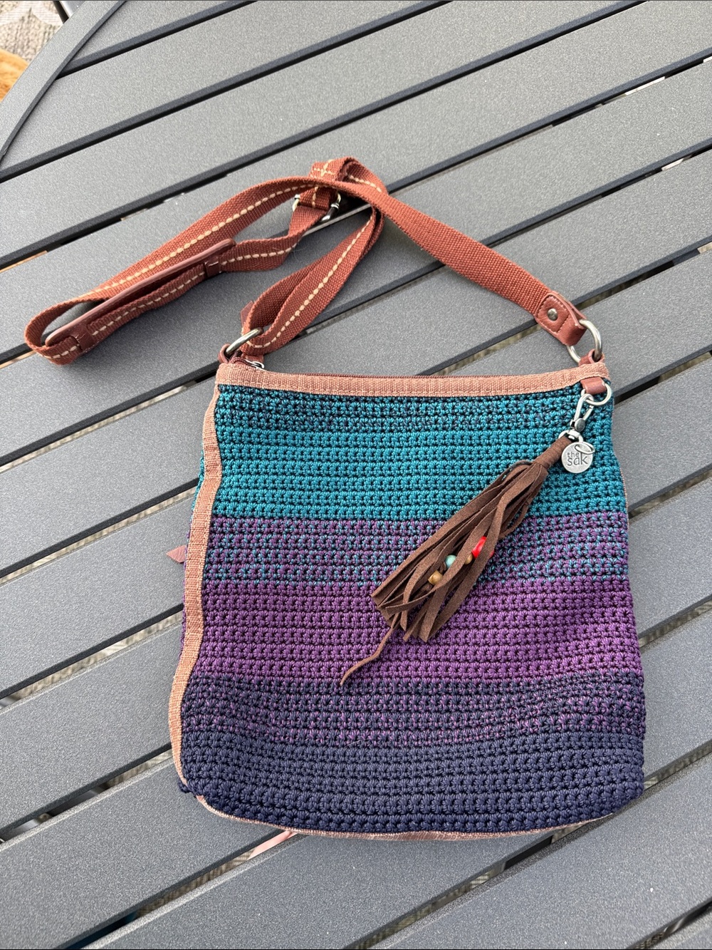 The Sak Crocheted Ombre Crossbody in Teal, Purple & Navy with Brown Trim
